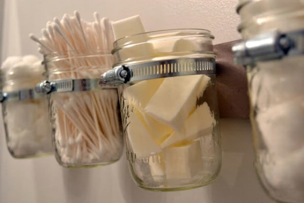 Mounted Mason Jars Add Extra Storage - 150 Dollar Store Organizing Ideas and Projects for the Entire Home