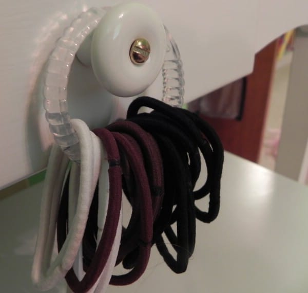 Shower Curtain Rings for Storing Ponytail Holders - 150 Dollar Store Organizing Ideas and Projects for the Entire Home