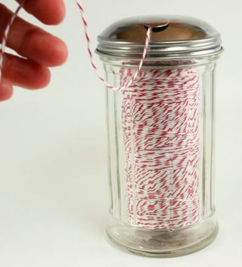 Baker’s Twine Dispenser from a Sugar Jar - 150 Dollar Store Organizing Ideas and Projects for the Entire Home