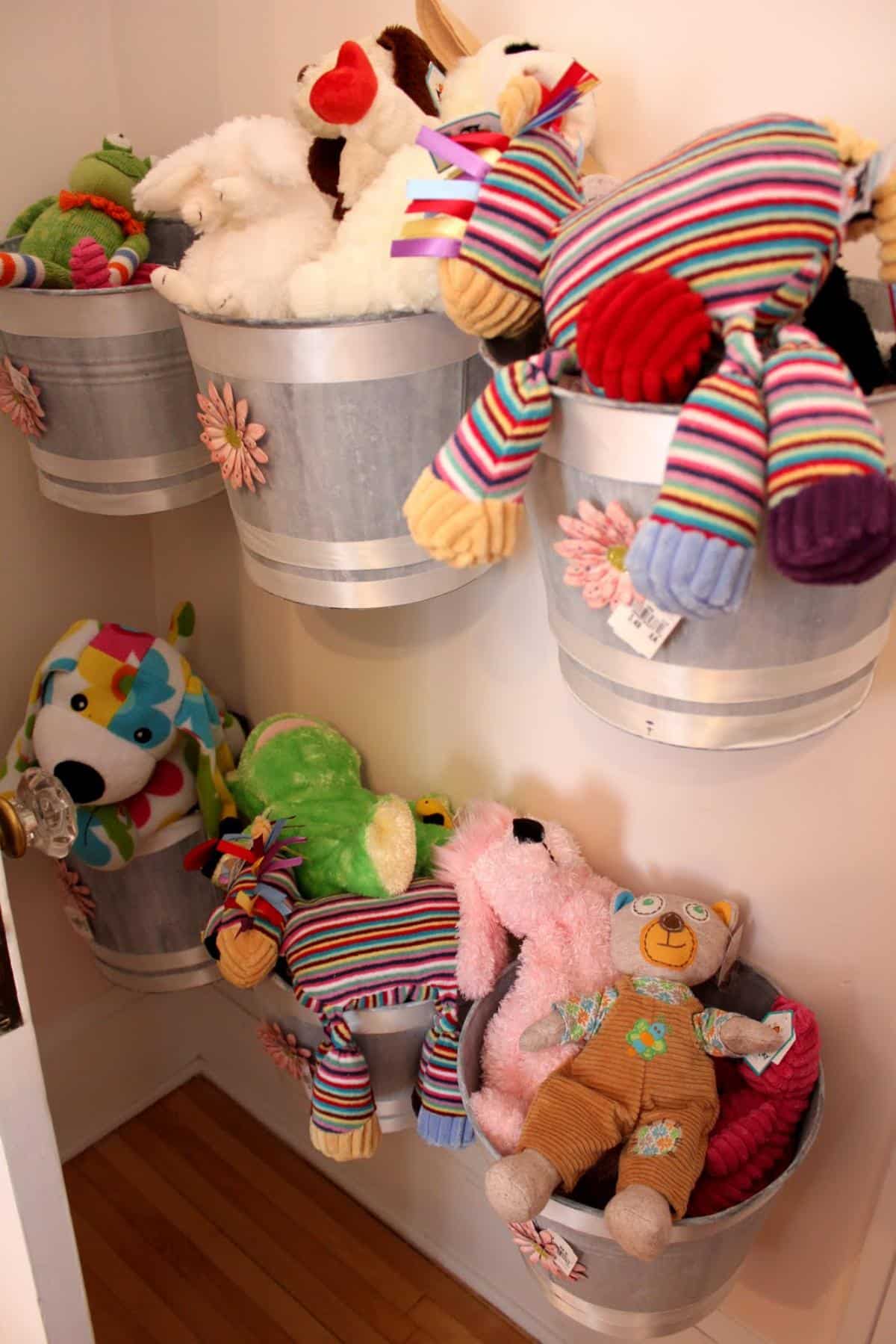 Hanging buckets as kid's playroom storage.