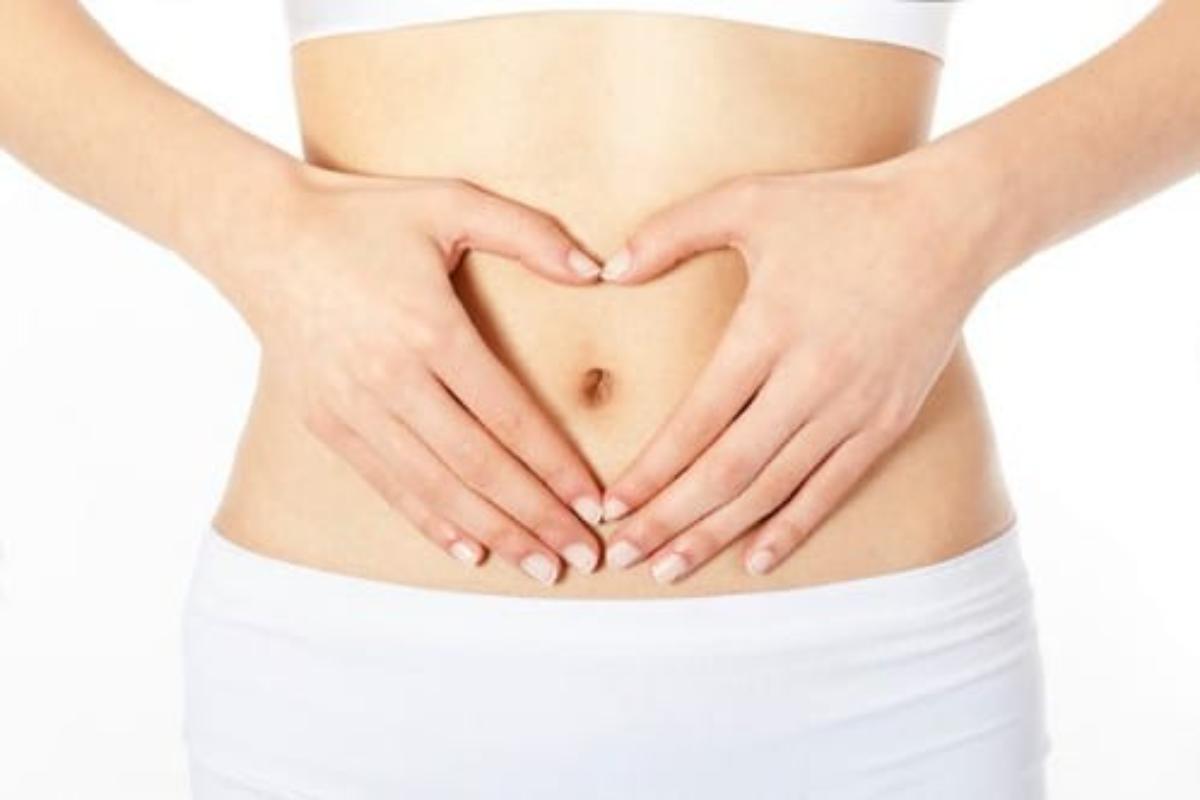 Woman hands on her stomach area.