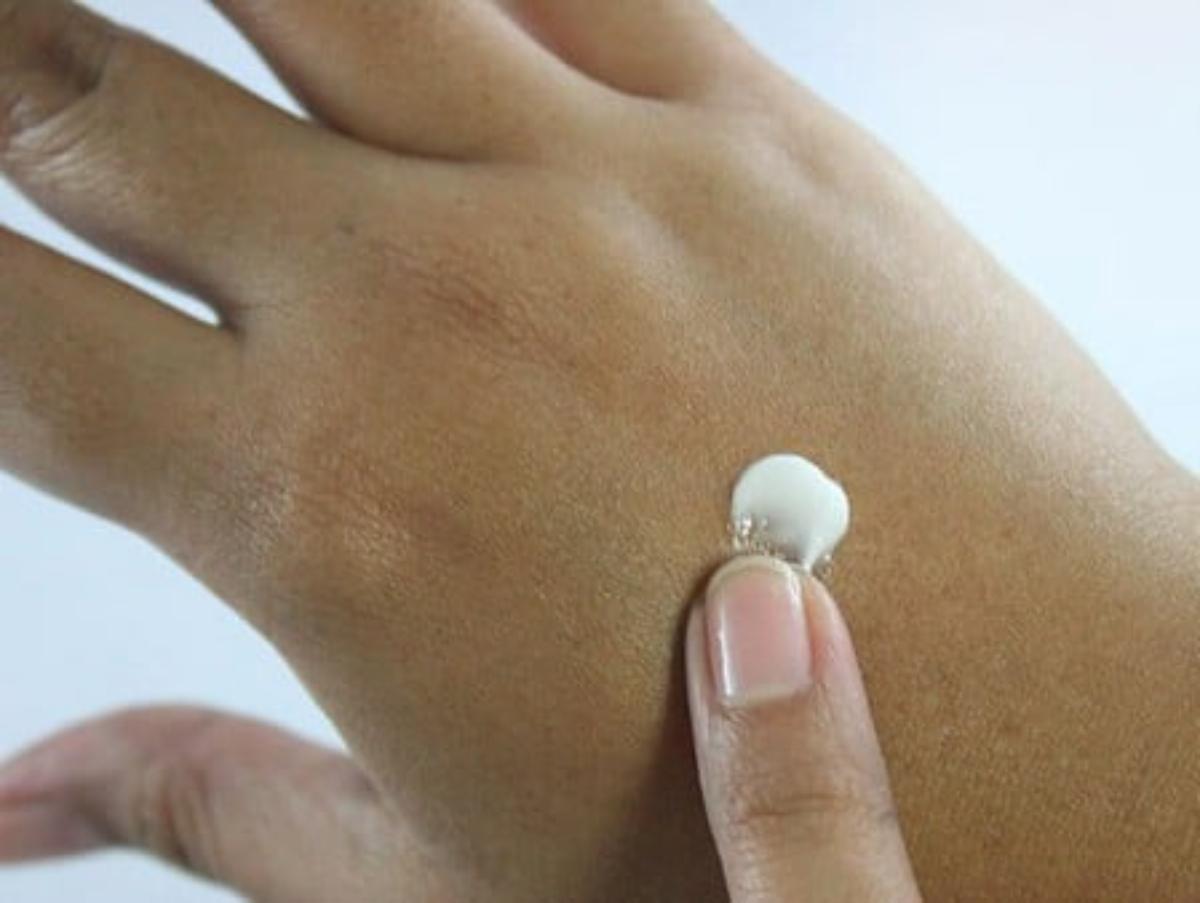 A drop of lotion on hand