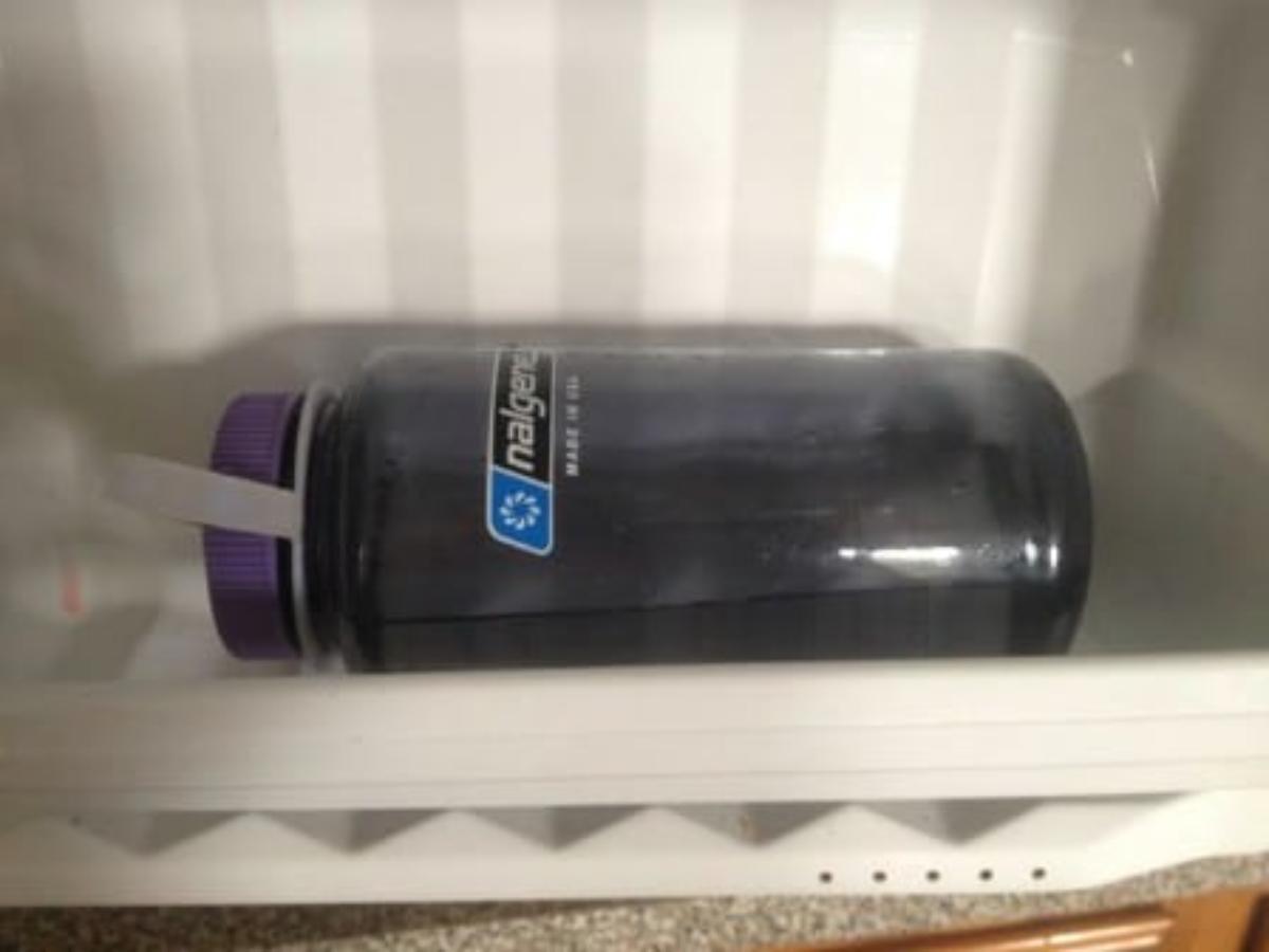 A water bottle in a freezer
