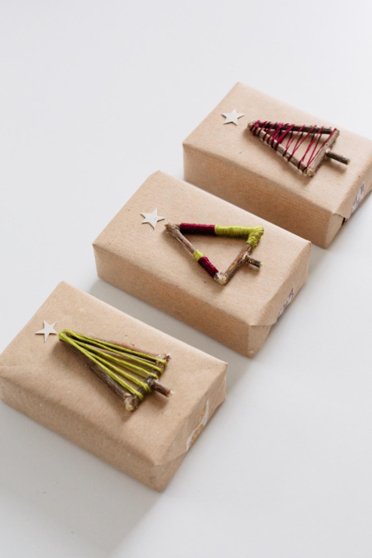 DIY Wood and string “rustic” Christmas trees gift wrappings.