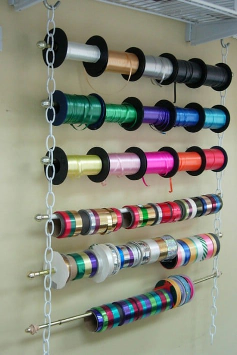 Make a ribbon holder use curtain rods and lengths of chain.