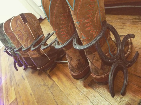 Beautiful boot rack made of horseshoes.