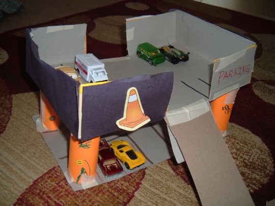 44. Drive a toy car up into a cereal box parking garage.