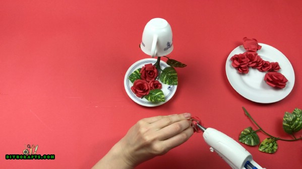 Gluing the roses to fork.