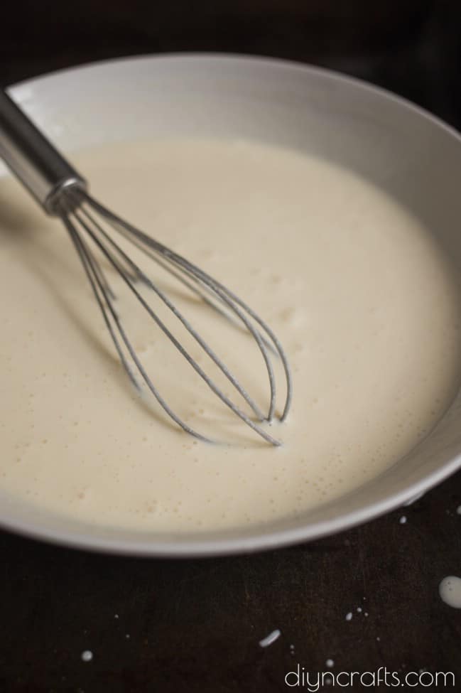 Mixing cheesecake until its smooth and creamy.