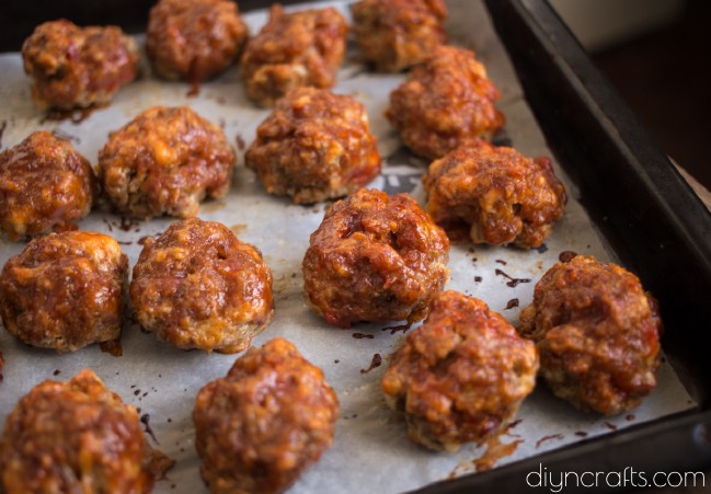 Glazing almost finished meatballs.