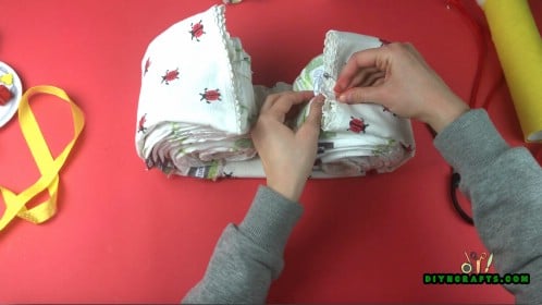 Fold blankets around the outside of each set of diapers (the top two batches together, and the bottom two batches together). Secure them.