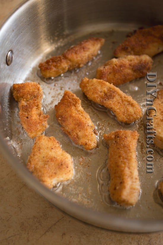 Brown chicken nuggets in oil to make them crispy