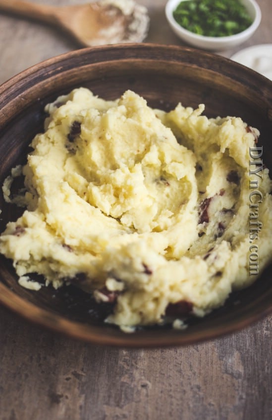 Mix mashed potatoes with garlic, bacon, and other ingredients
