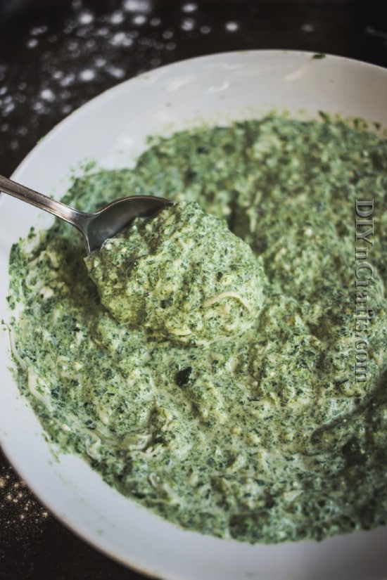  Combine spinach, feta, mozzarella, garlic, and eggs to get a creamy mixture