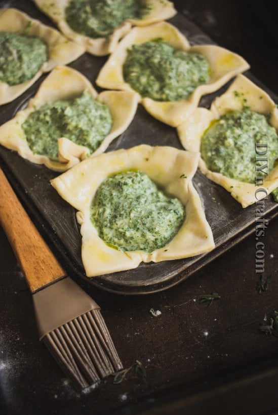 Fill puff pastry cups with spinach mixture