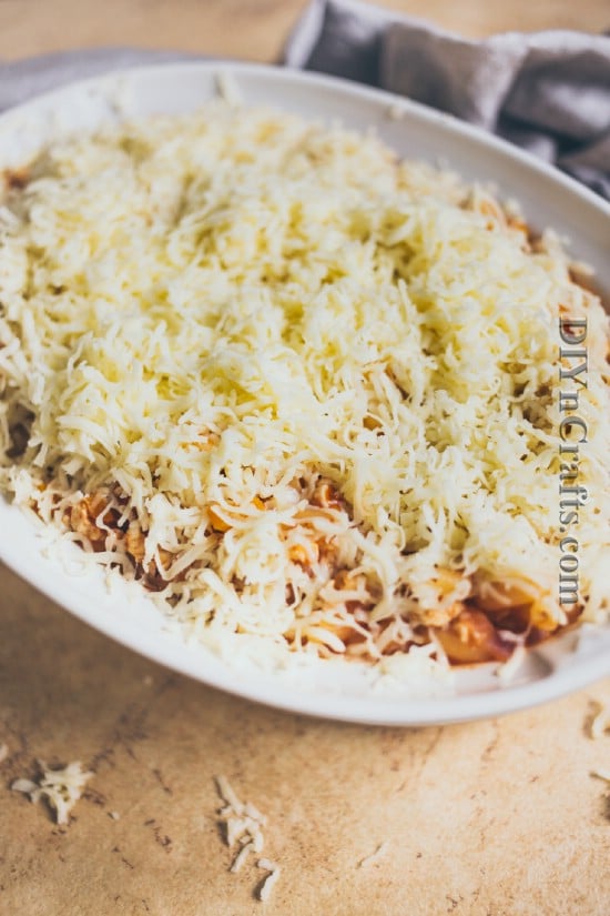  Add all ingredients to casserole dish and cover with shredded cheese
