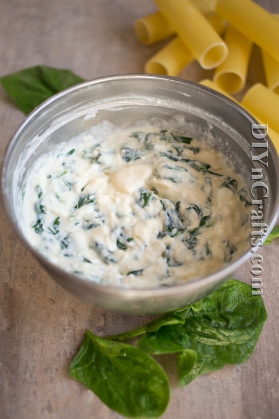 Mix ricotta with spinach, egg, and shredded cheese for filling