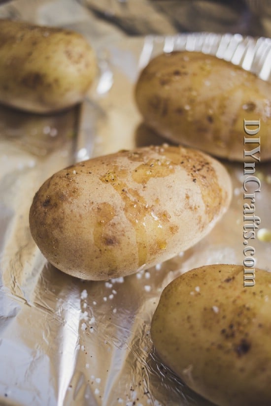 Prick potatoes with a fork and drizzle with olive oil before cooking