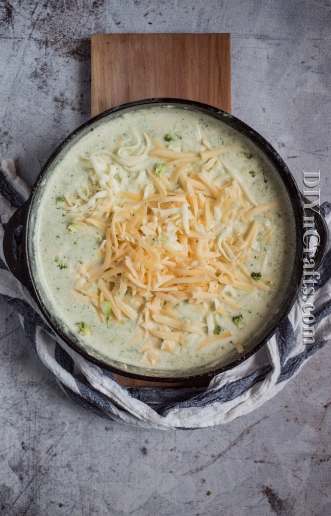 Topping with cheese.
