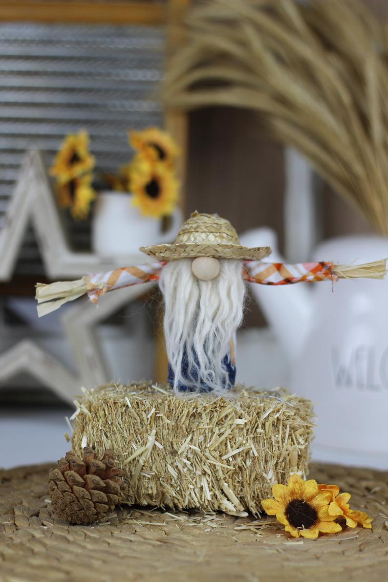 Scarecrow gnome on hay bale