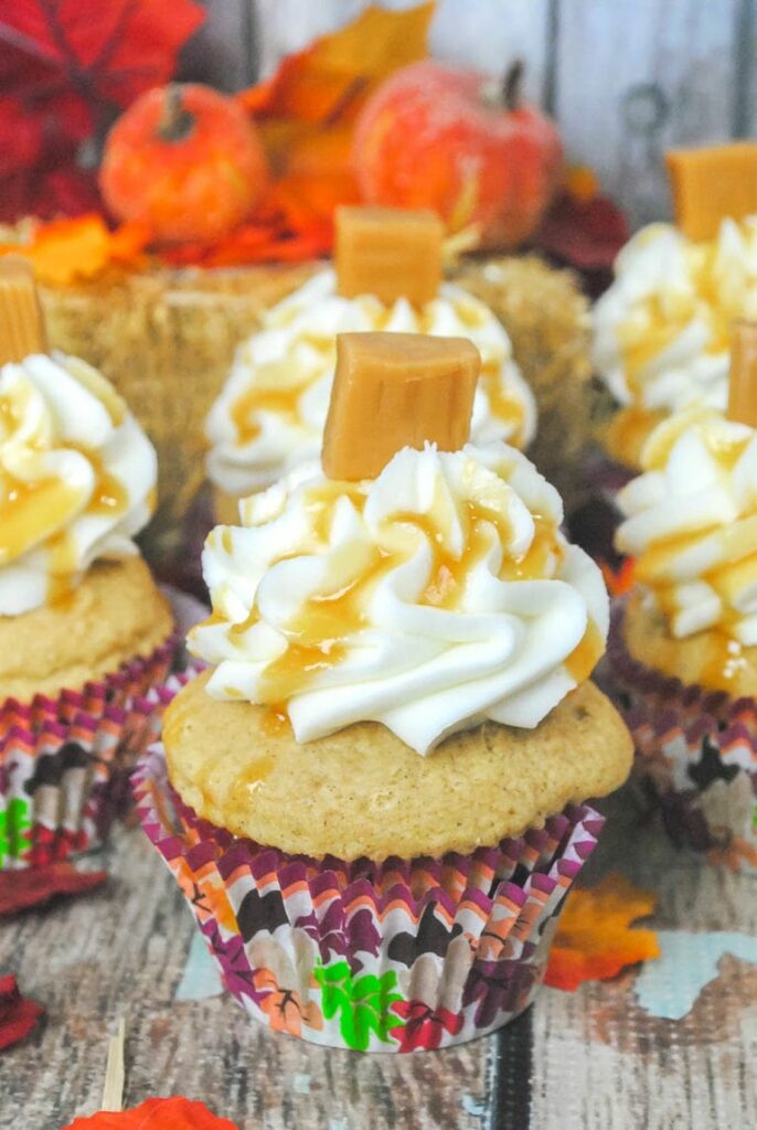Cupcakes topped with icing and caramel