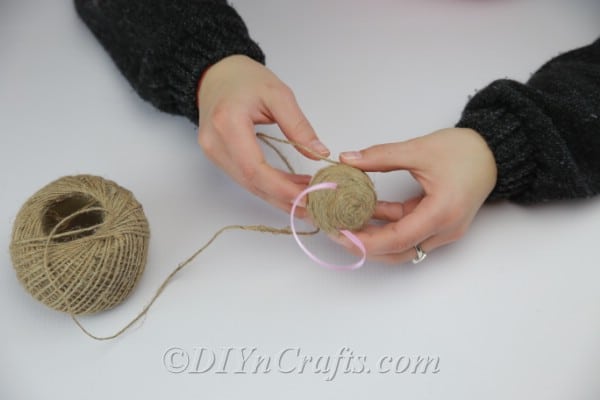 Continue to attach twine using hot glue.