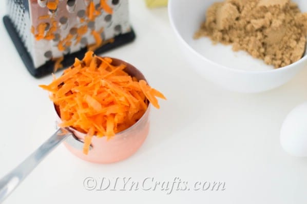 Grate one cup of fresh carrots