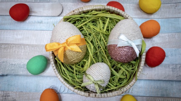 A basket filled with glitter Easter eggs