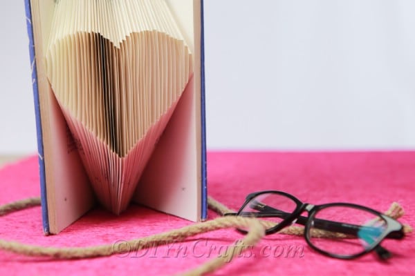 Book page heart beside glasses