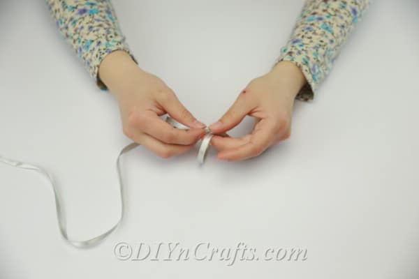 Measuring the ribbon to make a bracelet