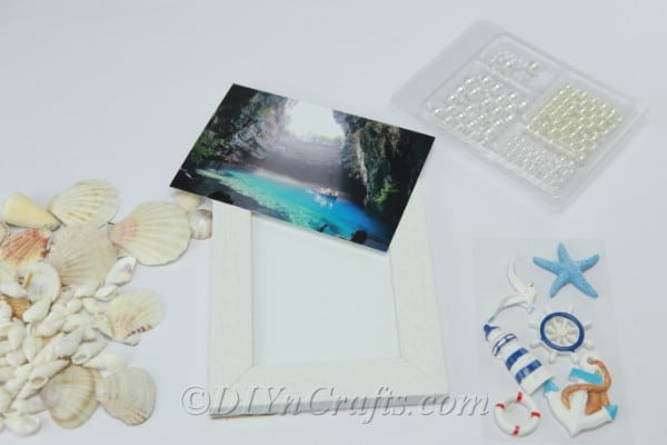 Supplies needed to make one seashell picture frame