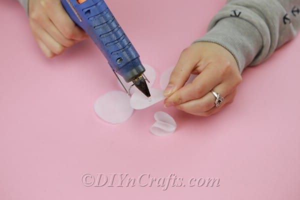 Adding glue to the center of a fabric circle