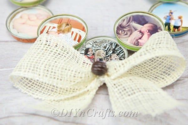 Up close picture of a rustic bow on a photo wreath