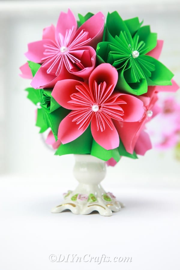 Close up image of a paper ball flower in a vase