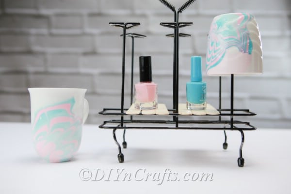 Marbled coffee cups on hanger with nail polish