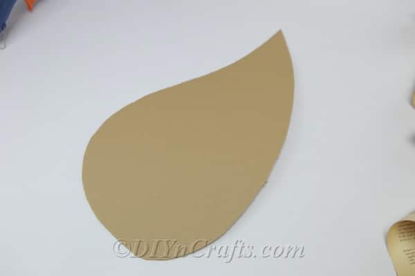A wing shape cut out of cardboard