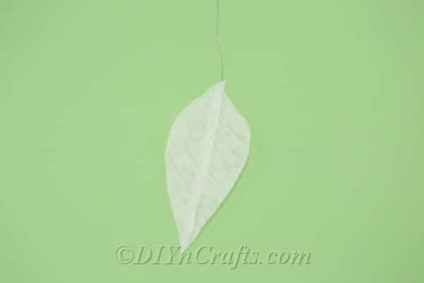 Tissue paper triangle cut into a leaf shape