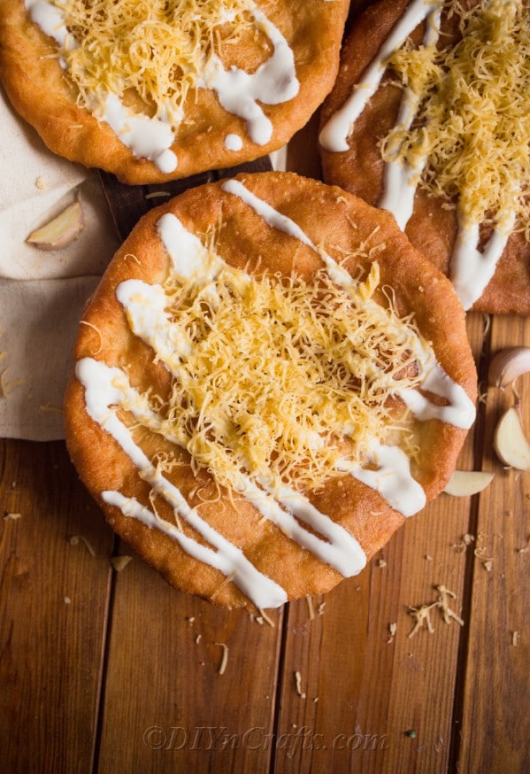 Langos with cheese and sour cream on top