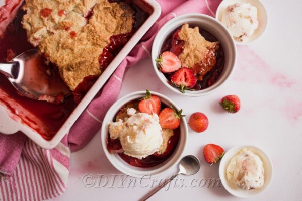 Strawberry cobbler served with ice cream on top