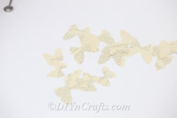 You now have an assortment of large and small butterfly shapes cut from multiple pages.