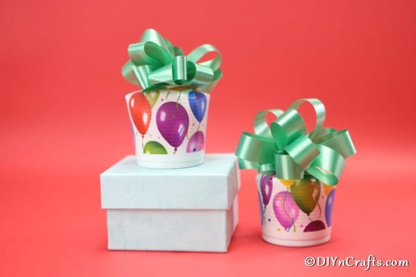 Two completed cookie boxes sitting on a red surface