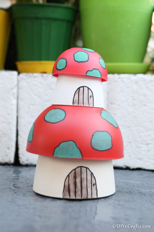 Mushroom planter fairy houses stacked on top of each other