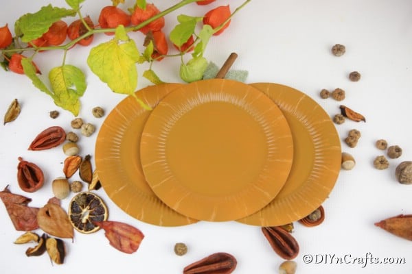 A completed paper pumpkin paper plate craft