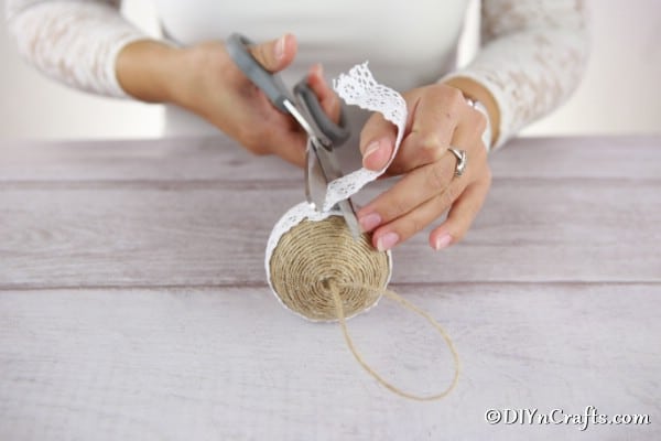 Adding lace to the middle of the rustic Christmas ornaments
