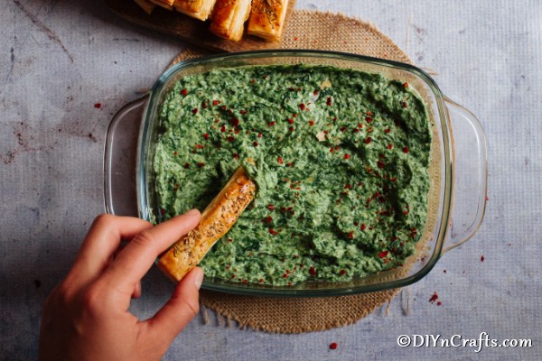 Overhead picture of spinach dip in a large glass bowl