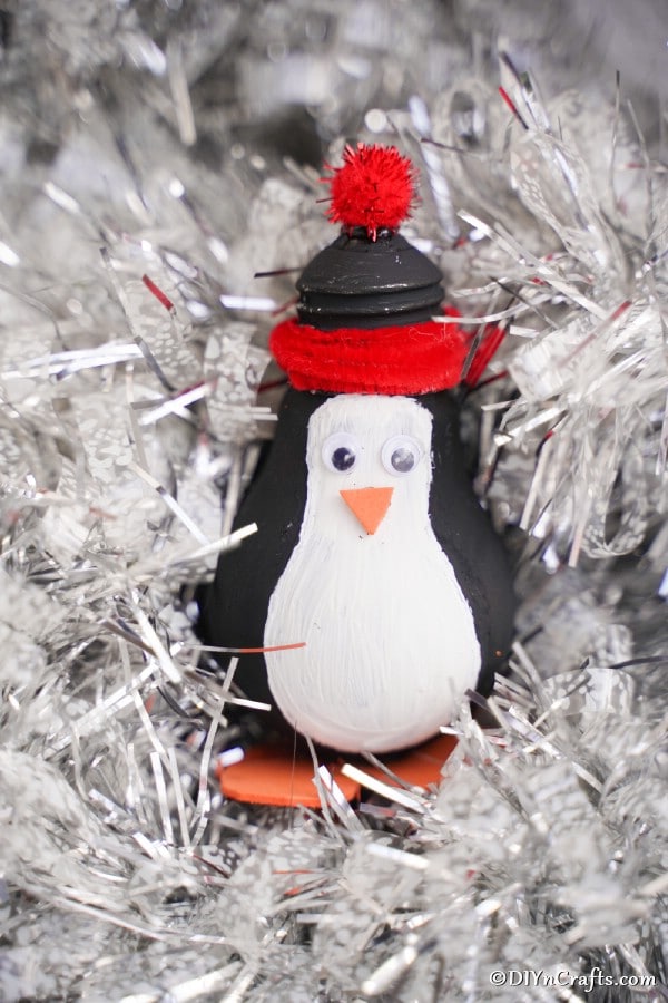A penguin decoration in white Christmas tree