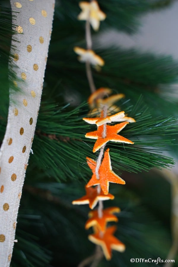 Orange peel star garland displayed on a Christmas tree