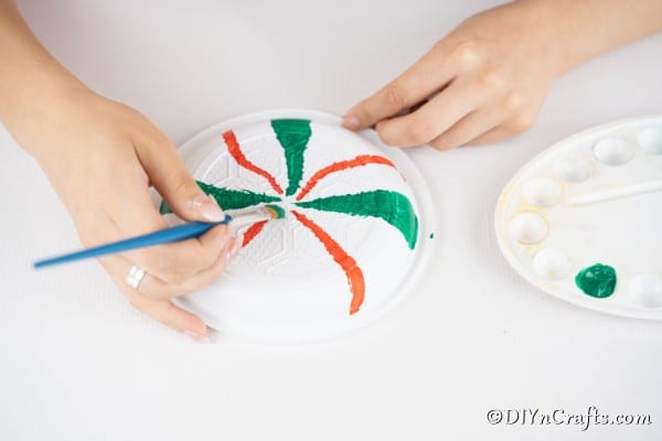 Adding paint lines to plates for making giant lollipops