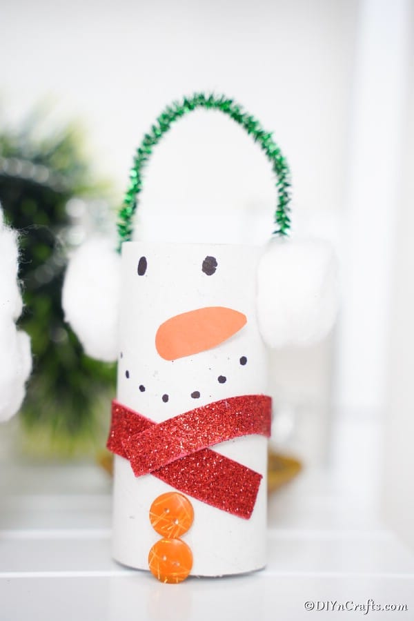 A snowman toilet paper roll craft displayed