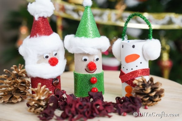 Up close picture of a trio of toilet paper roll crafts for Christmas